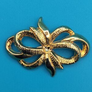 AVON Abstract Bow Pin Brooch 1.75" Gold Tone Textured Clear Stone Vintage